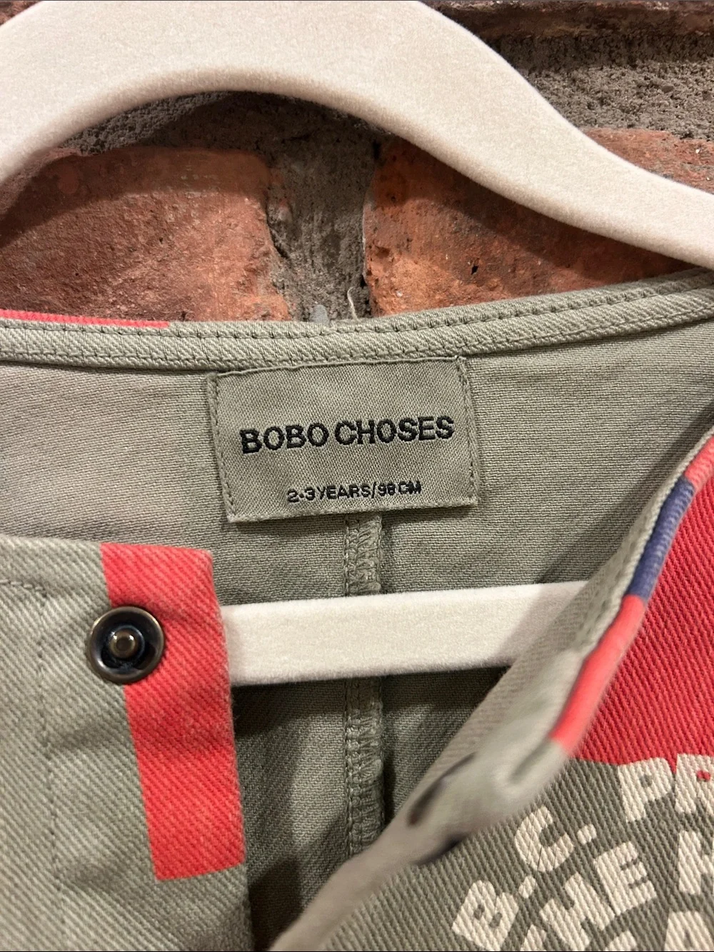 Bobo Choses Olive Green Jumpsuit with Coral & Navy Geometric Print
